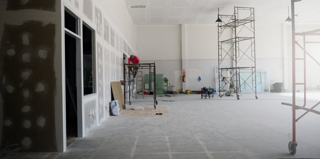 Worker performing post-construction cleanup services