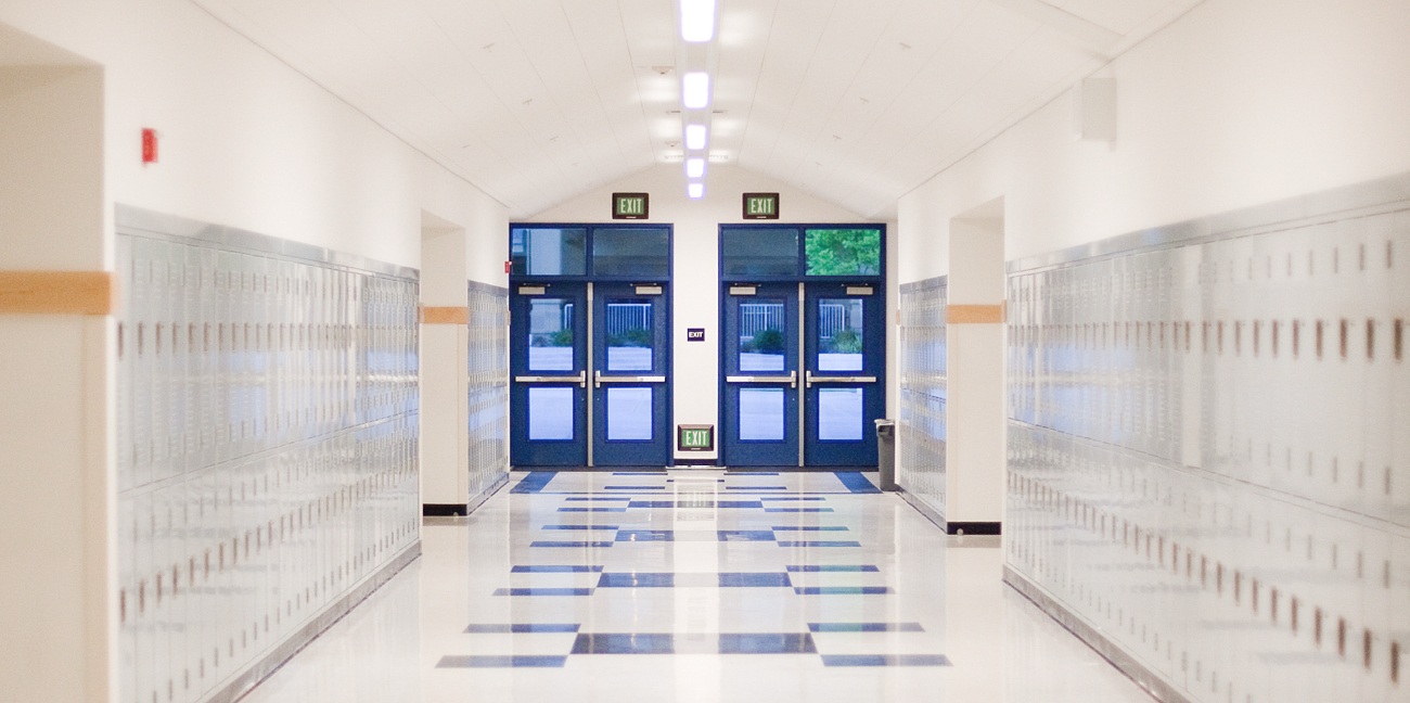 School Hallway Leading to an Exit Door
