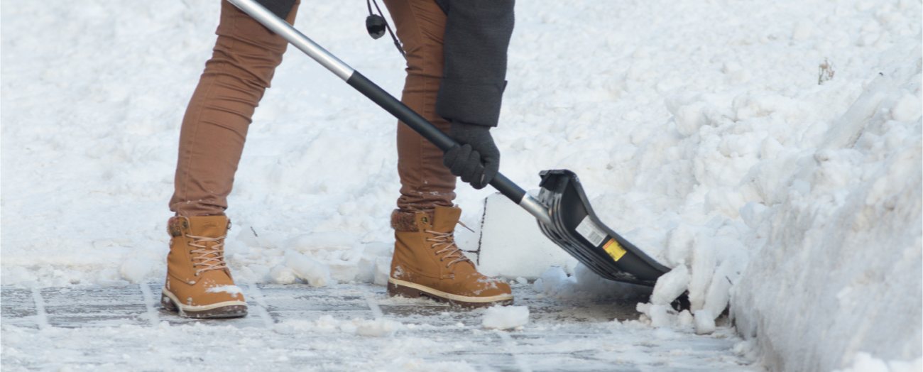 Individual Shoveling Snow