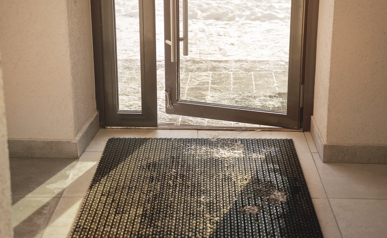 Entry Way to a Building with a Dirty Carpet